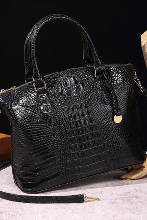 Black crocodile embossed satchel bag with top handles and shoulder strap