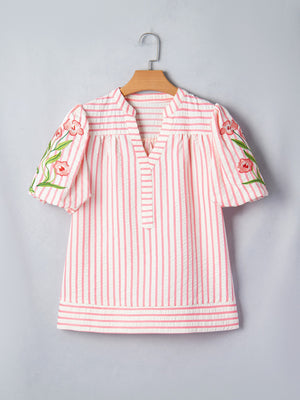 Pink and white striped blouse with floral embroidered puff sleeves and V-neck