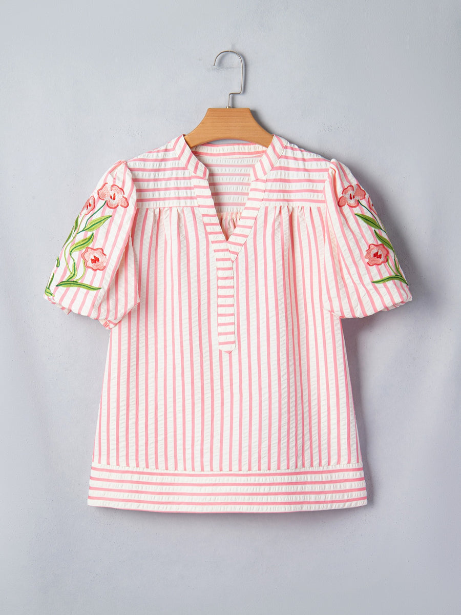 Pink and white striped blouse with floral embroidered puff sleeves and V-neck