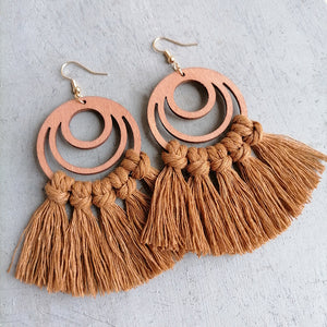 Brown wood hoop earrings with knotted fringe tassels