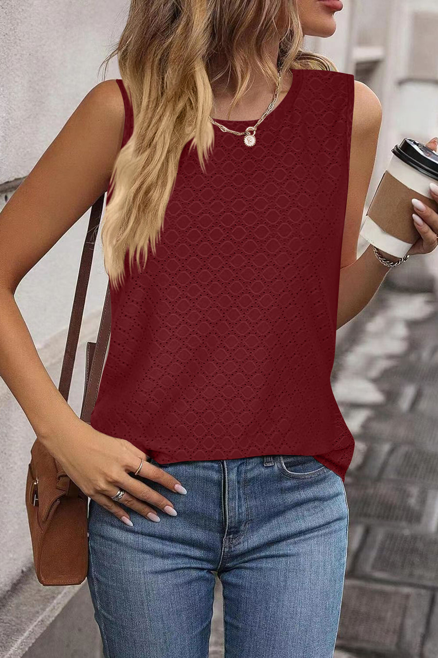 Burgundy sleeveless scoop neck top with allover diamond texture.