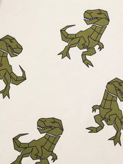 Cream cotton baby tee with geometric green dinosaur print
