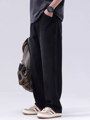 Men's black vintage wash loose fit jeans, cotton denim.
