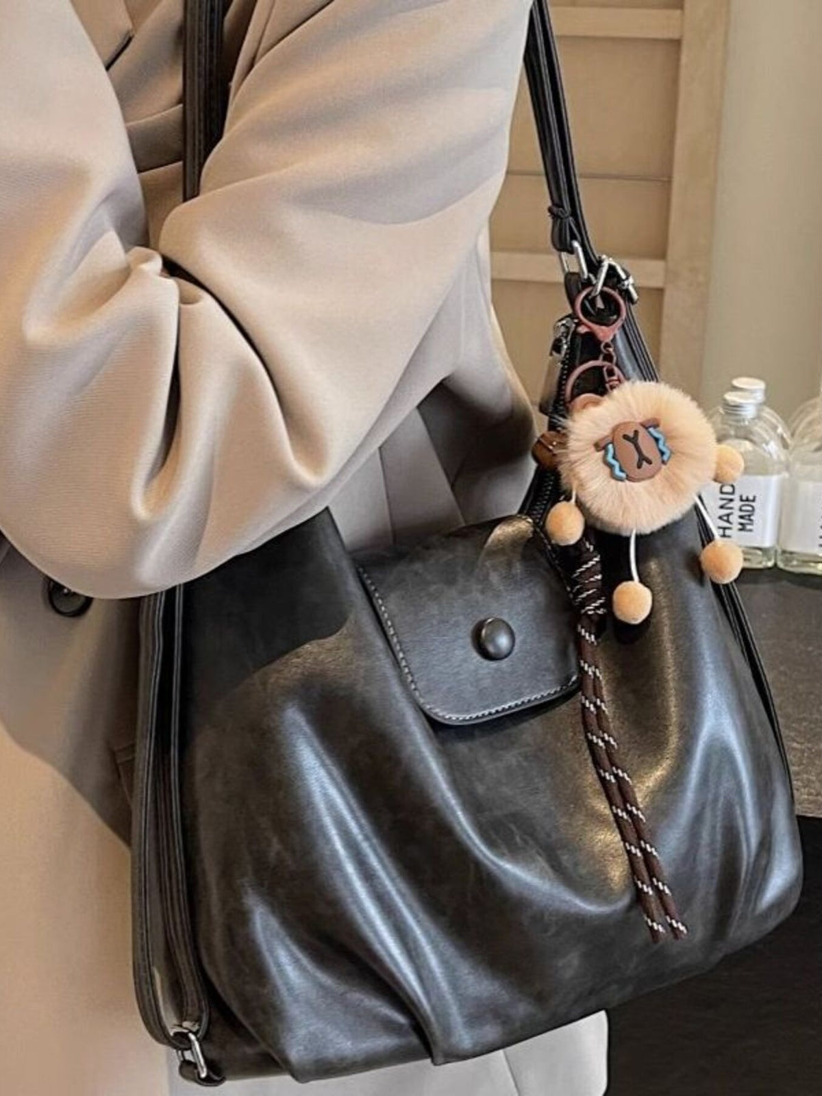 Black vintage pu leather shoulder bag with distressed finish and cute lion charm