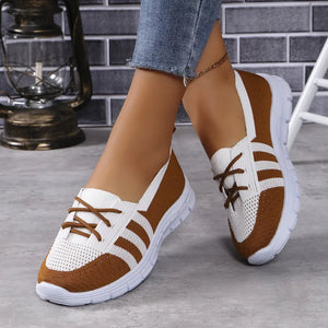 Brown and white breathable knit lace-up sneakers with striped detail.