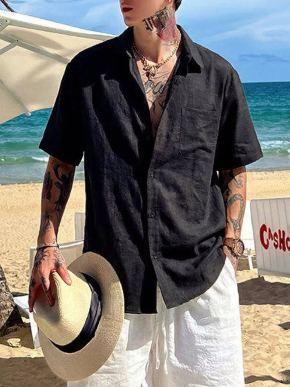 Black relaxed fit buttoned casual shirt with short sleeves and a chest pocket.