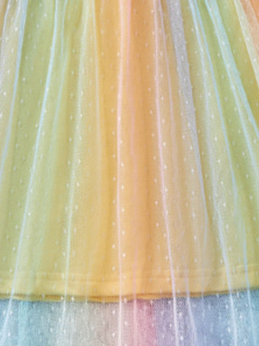 Toddler rainbow ombre tulle dress with white dot pattern.