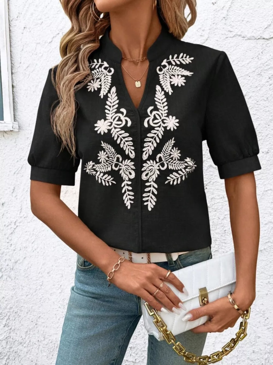 Black embroidered notched blouse with cuffed sleeves and a V-neck.