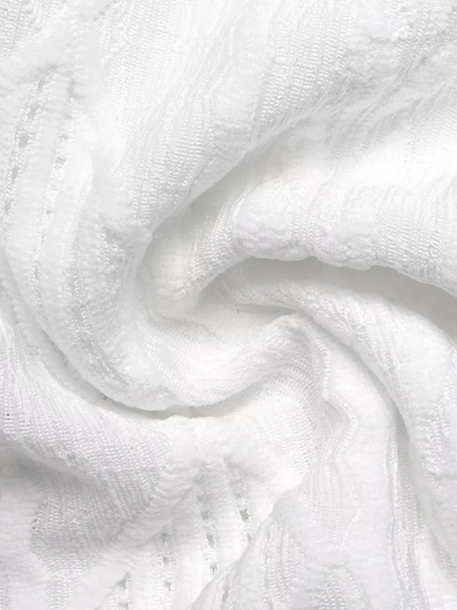 White textured knit maternity t-shirt with openwork detail and bow accent.