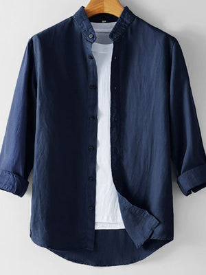 Navy blue linen band collar long sleeve shirt layered over a white t-shirt