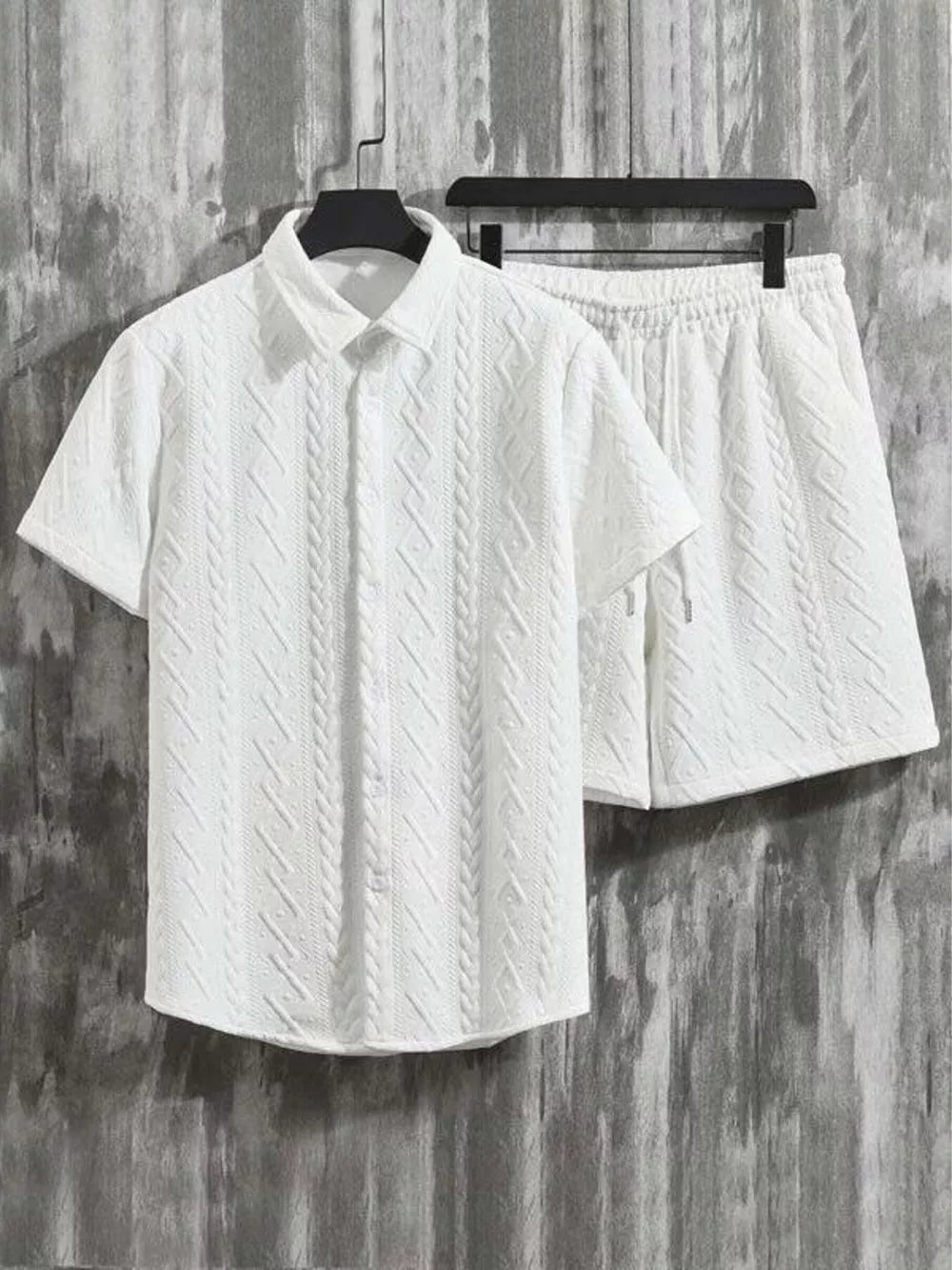 White knit polo shirt and shorts set with cable knit texture and drawstring waist.