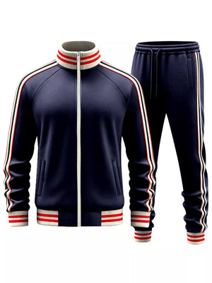 Navy blue tracksuit with white and red striped collar, cuffs, and side stripes.