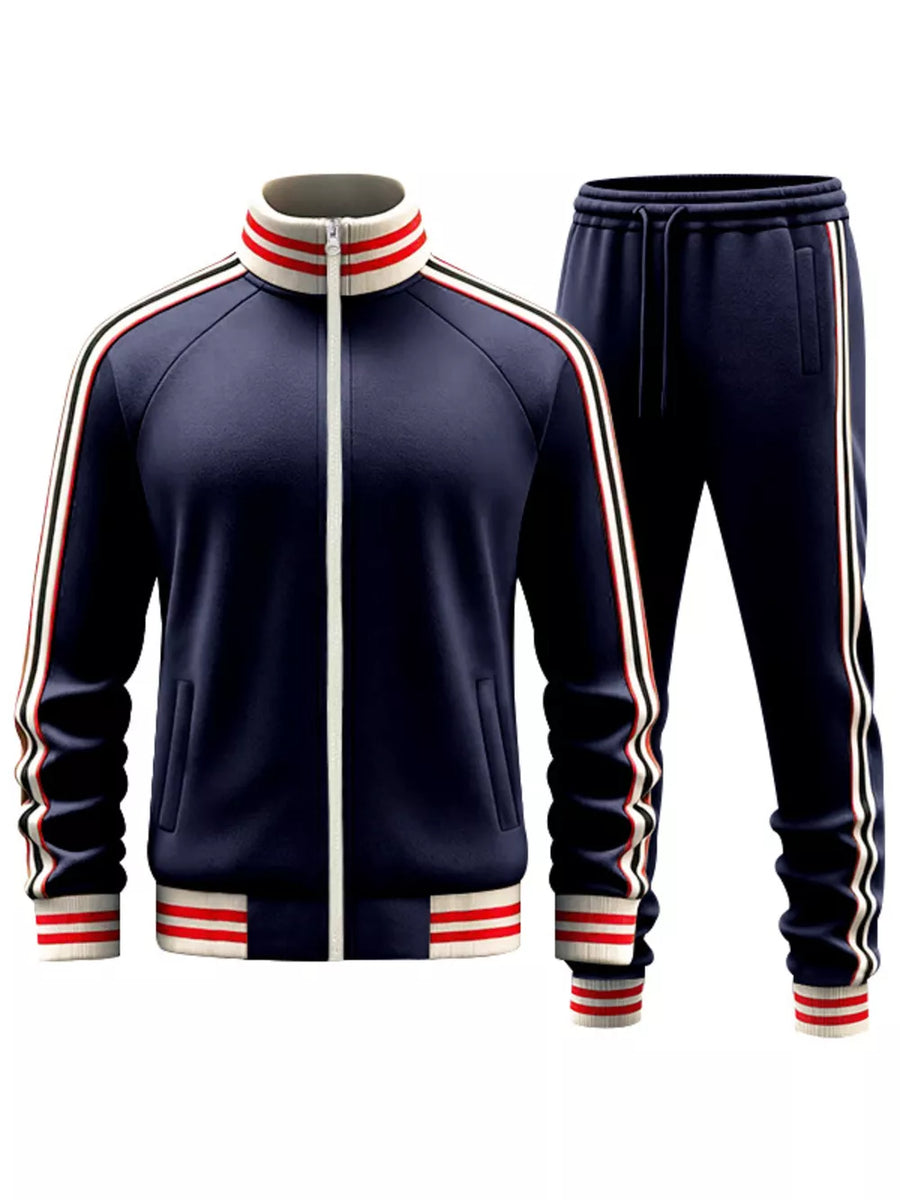 Navy blue tracksuit with white and red striped collar, cuffs, and side stripes.