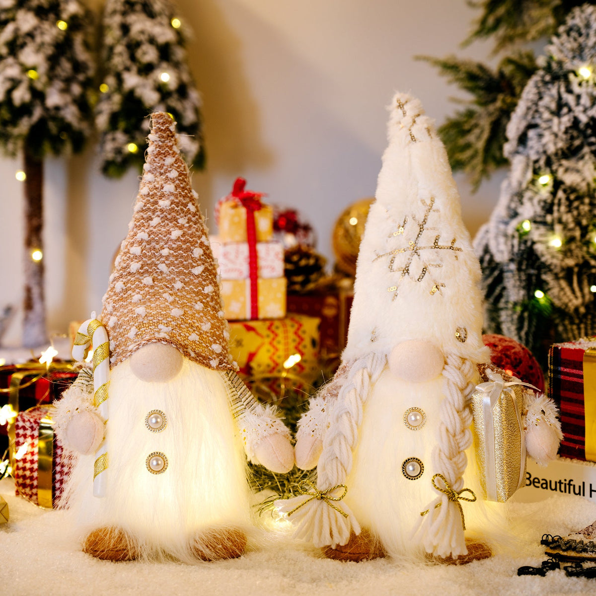 Illuminated festive gnomes, male and female, with glowing bodies and decorative hats.
