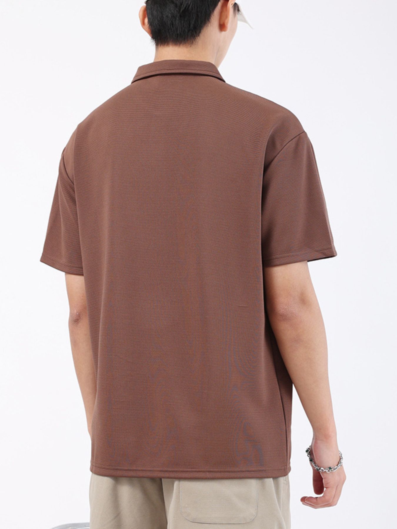 Brown textured performance polo shirt for men, short sleeves, classic collar.