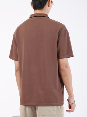 Brown textured performance polo shirt for men, short sleeves, classic collar.