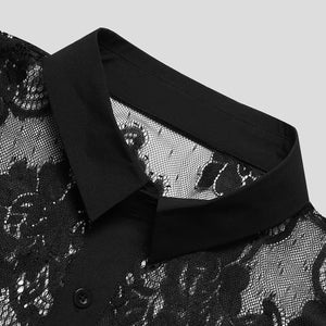 Black sheer floral embroidered button-down shirt with a classic collar and button detail.