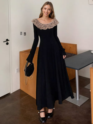 Black a-line dress with lace collar and bell cuffs, ankle length