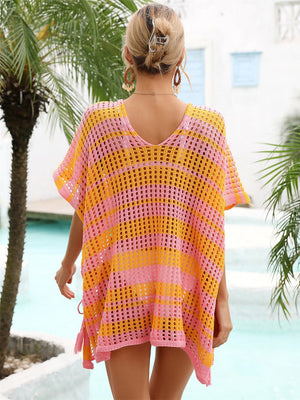 Striped crochet beach cover-up in pink and orange with drawstring detail.