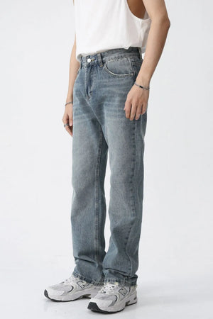 Relaxed fit medium wash straight leg denim jeans with a casual style.