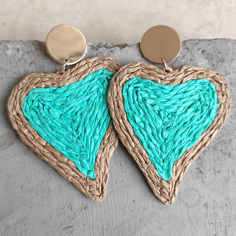 Aqua woven heart statement earrings with gold disc detail.