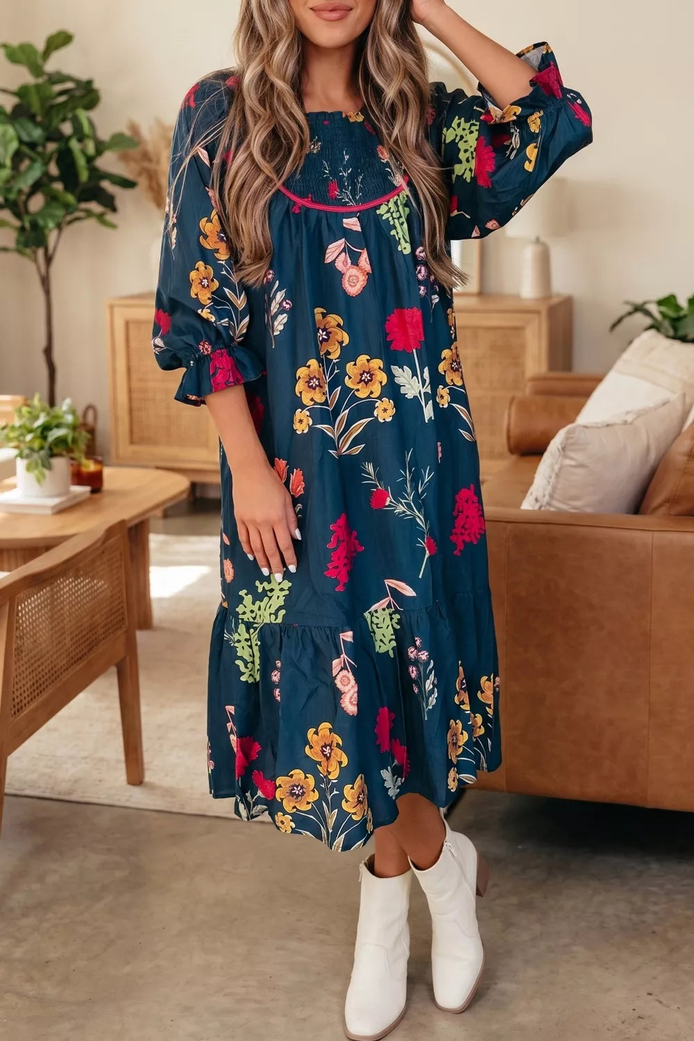 Navy floral print midi dress with smocked bodice, square neck, ruffled sleeves and tiered skirt.