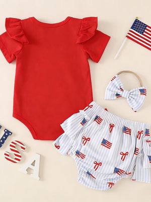 Red baby bodysuit with ruffled sleeves and striped flag print shorts with ruffled trim.