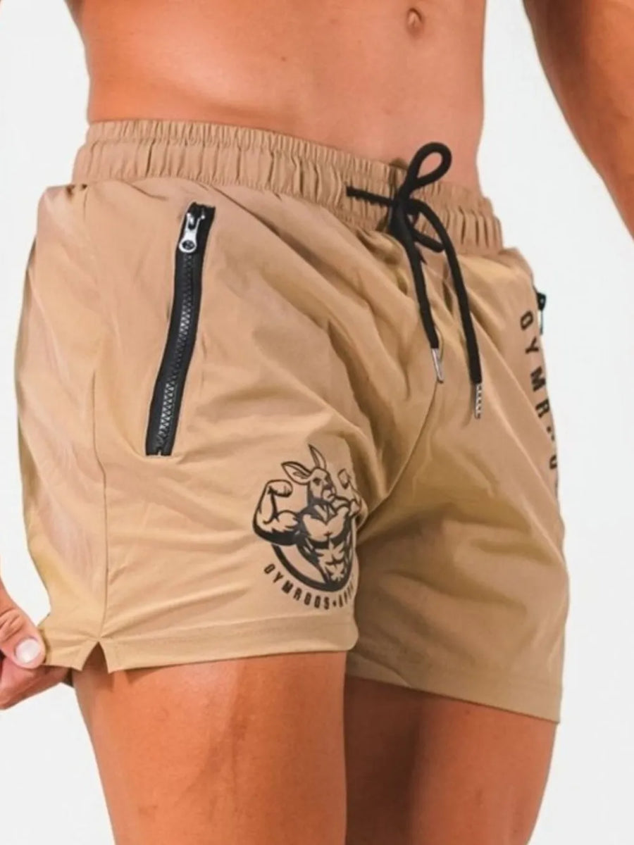 Khaki athletic shorts with drawstring, zipper pocket, and kangaroo graphic logo.