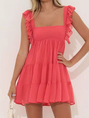 Mini dress in watermelon red with square neck, ruffled cap sleeves, and tiered skirt.