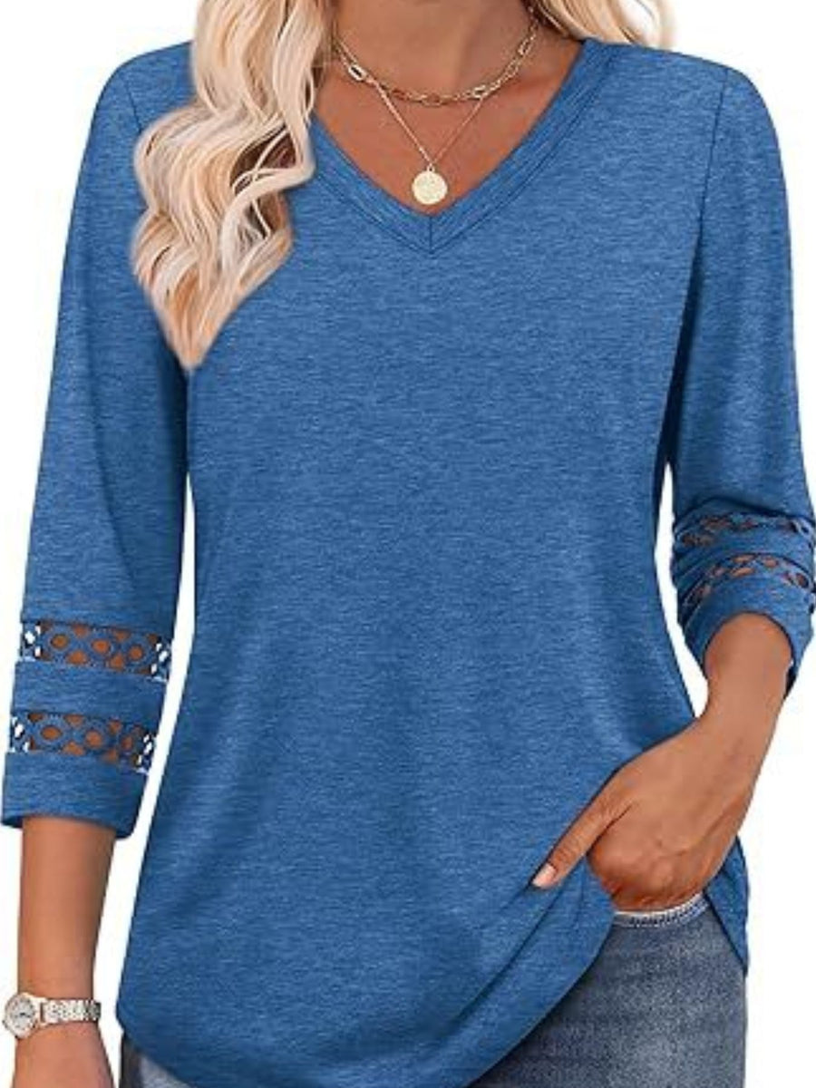 Blue V-neck t-shirt with 3/4 sleeves featuring cutout lace detail on the cuffs.