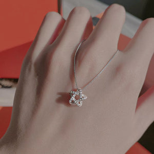 clear necklace featuring star pendant and star