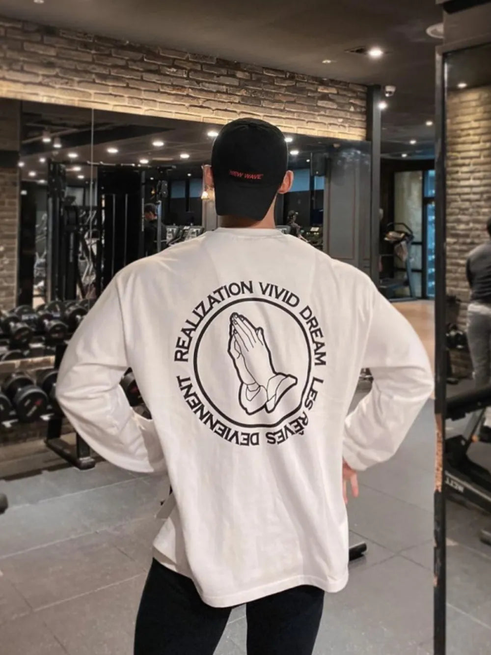 White long sleeve tee with praying hands graphic and text on back