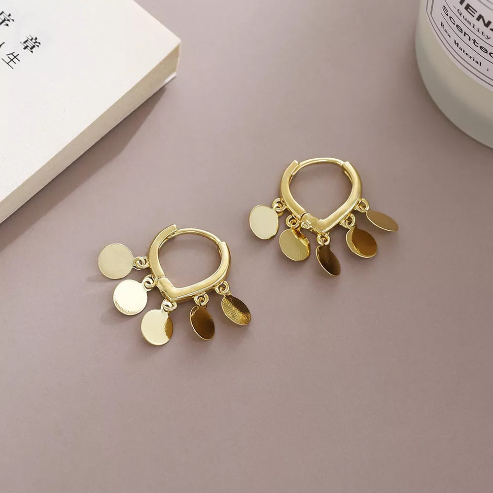 earrings in gold featuring hoop and drop fit