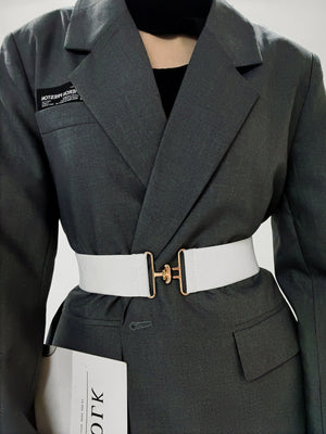 White elastic belt with gold sculpted buckle detail