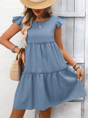 Gray blue ruffled cap sleeve mini dress with tiered skirt and round neckline.