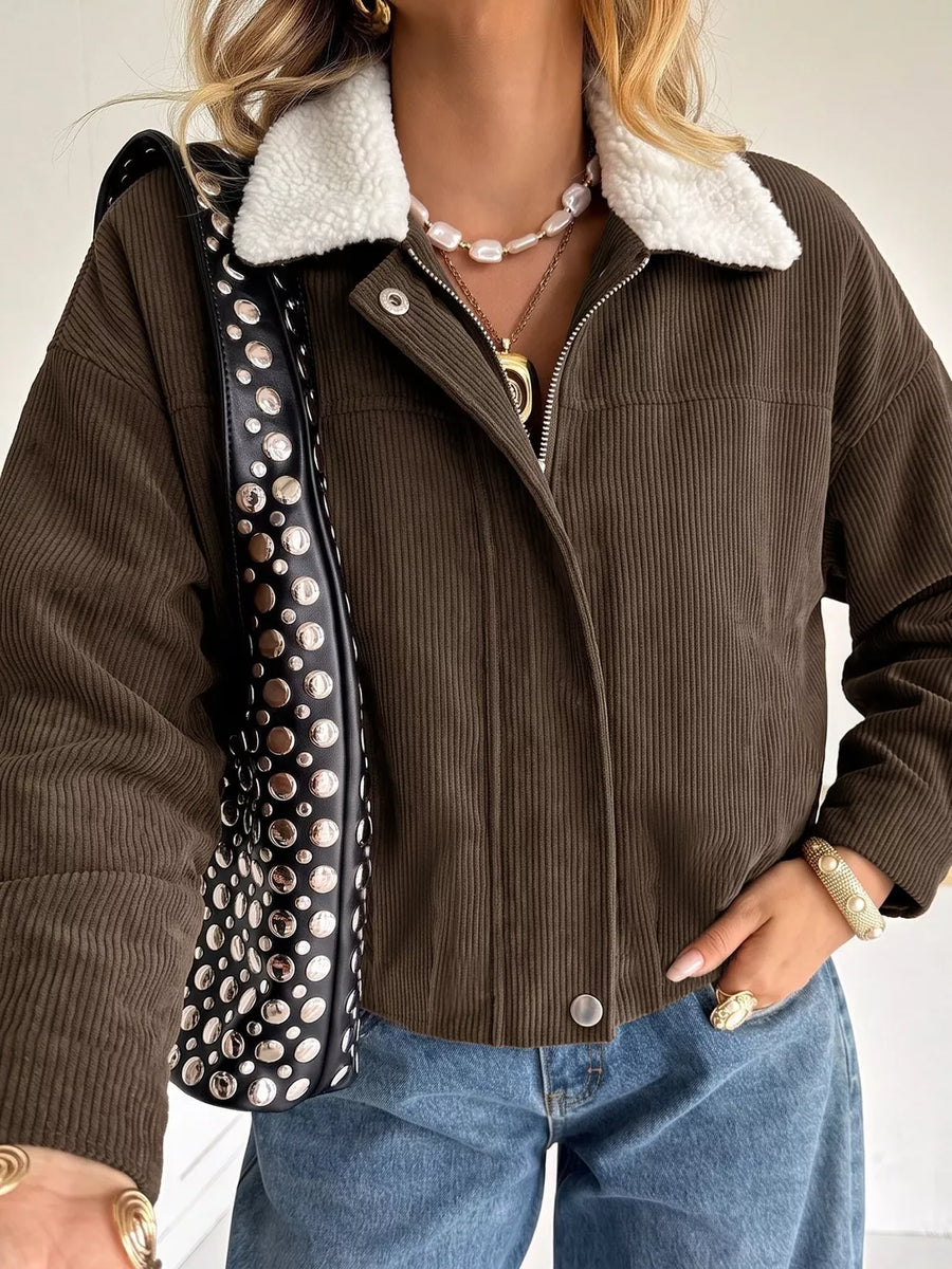 100% polyester Care instructions: Machine wash cold trucker jacket in Brown with relaxed silhouette