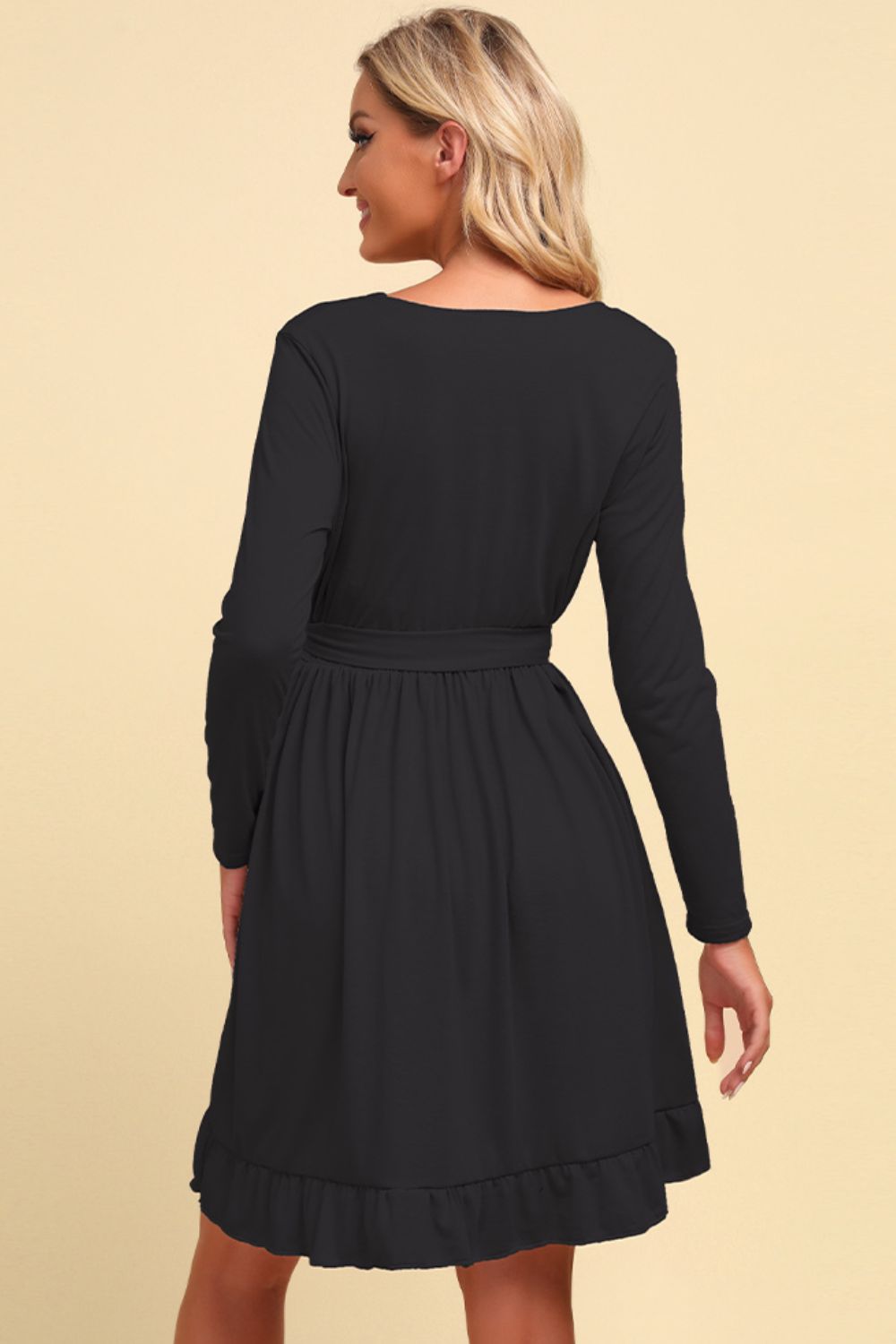 Black long sleeve wrap dress with ruffled hem and tie waist