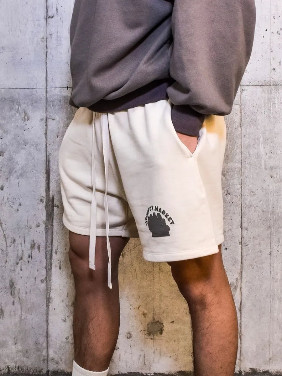 Ivory fleece drawstring shorts with black market logo detail
