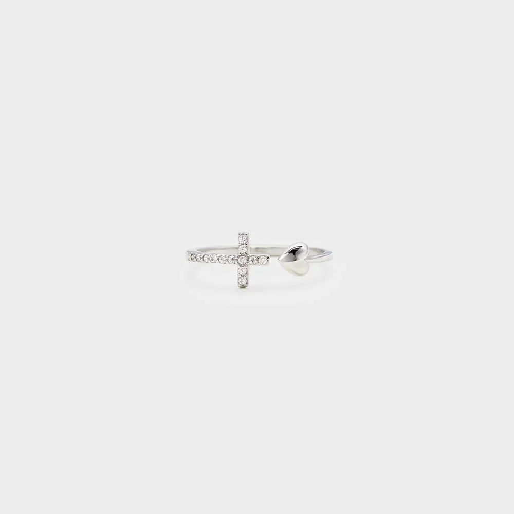Silver ring with open heart and diamond-accented cross detail