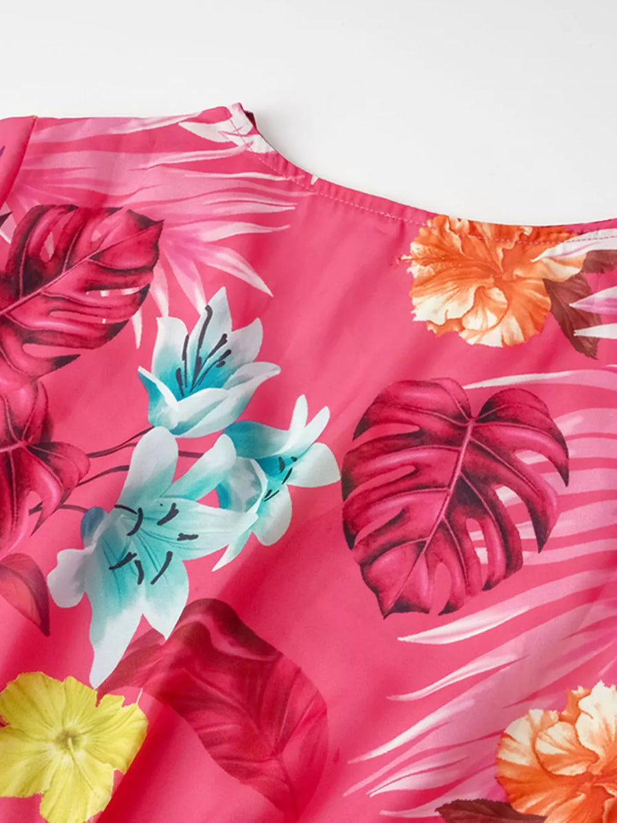 Hot pink tropical floral midi dress with pleated detail and belt.