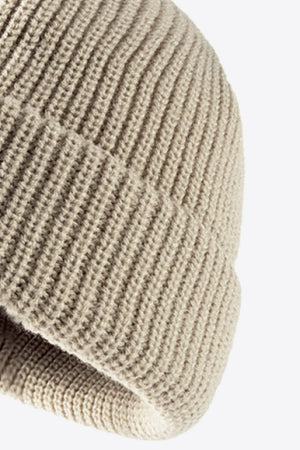 Beige ribbed knit beanie with folded edge detail