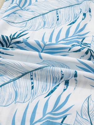 Tropical leaf print wide leg pants in blue and white cotton fabric.