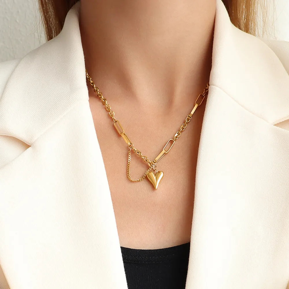 Gold heart drop chain link necklace with delicate chain accent