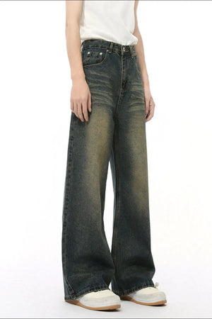 Whiskered denim straight leg jeans in a dark wash with a vintage fade.