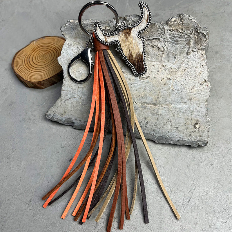 Cowhide bull skull keyring with multi-color leather fringe and silver hardware.