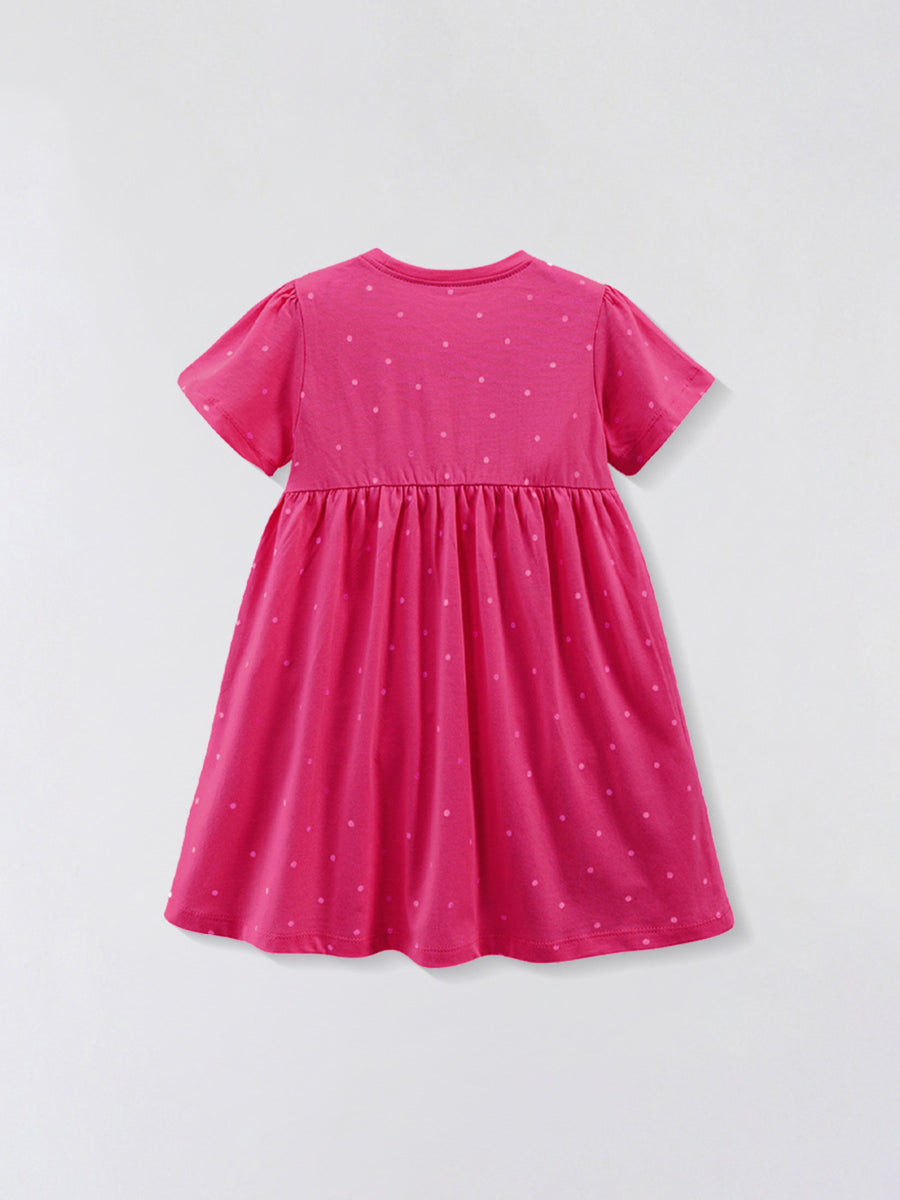 Pink cotton baby dress with scattered polka dots, crew neck, short sleeves, and gathered skirt.