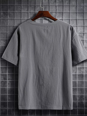 Grey cotton crew neck t-shirt with short sleeves and a textured finish.