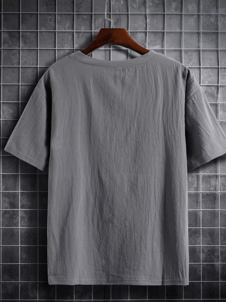 Grey cotton crew neck t-shirt with short sleeves and a textured finish.