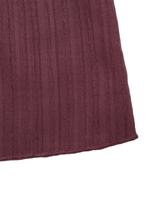 Chic one-shoulder romper in maroon ribbed fabric with tie waist detail.