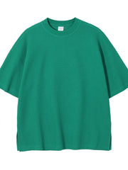Green waffle knit boxy t-shirt with crew neck and short sleeves.
